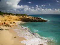 Another part of Cupecoy Beach which is probably almost a kilometer long but punctuated by rugged rocks and cliffs that sometimes extend right out into the sea as shown here.